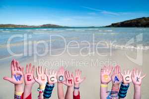 Children Hands Building Word Welcome Back, Ocean Background