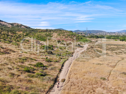 Aerial view of Los Penasquitos Canyon Preserve with tourists and hikers on the trails, San Diego