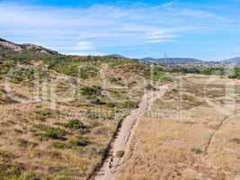 Aerial view of Los Penasquitos Canyon Preserve with tourists and hikers on the trails, San Diego