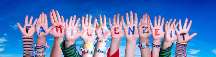 Children Hands Building Word Familienzeit Means Familytime, Blue Sky