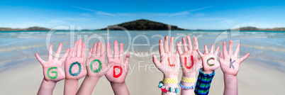 Kids Hands Holding Word Good Luck, Ocean Background