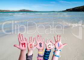 Children Hands Building Word Merci Means Thank You, Ocean Background