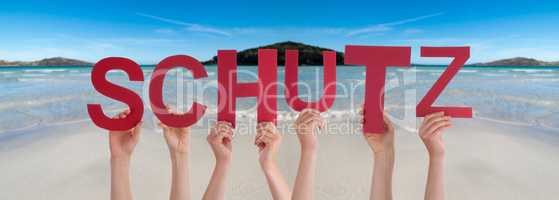 People Hands Holding Word Schutz Means Protection, Ocean Background