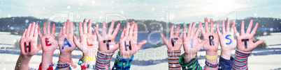 Children Hands Building Word Health First, Snowy Winter Background