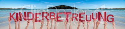People Hands Holding Word Kinderbetreuung Means Child Care, Ocean Background