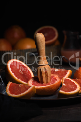 squeezing juice from grapefruit