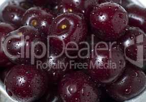 Fresh ripe cherries with water drops, as background.