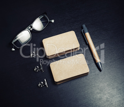 Business cards, pen, glasses