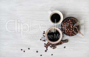 Coffee cups and beans