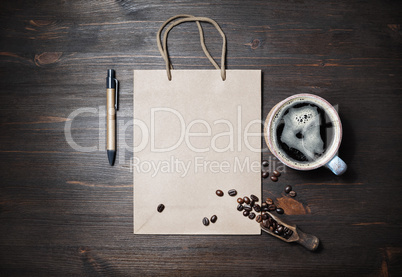 Paper bag, coffee and pen