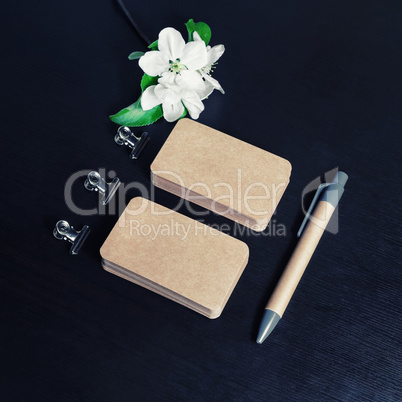 Business cards, pen, flowers