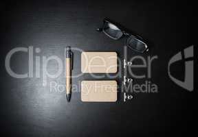 Business cards, pen and glasses