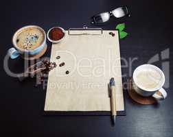 Clipboard, coffee, pen