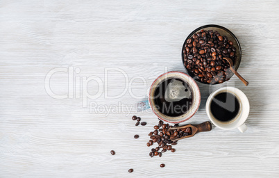 Cups of coffee, coffee beans