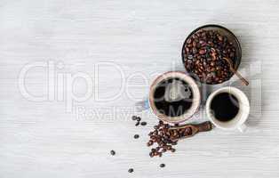 Cups of coffee, coffee beans