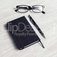 Notepad, glasses and pencil