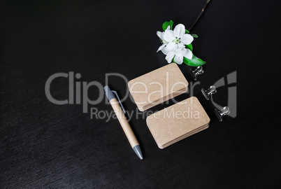 Business cards, pen, flowers