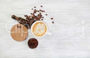 Coffee on light wood table