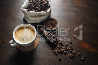 Coffee cup, beans, ground powder