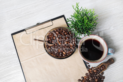 Coffee, clipboard with kraft paper