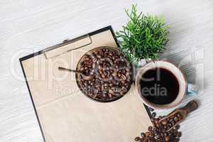 Coffee, clipboard with kraft paper
