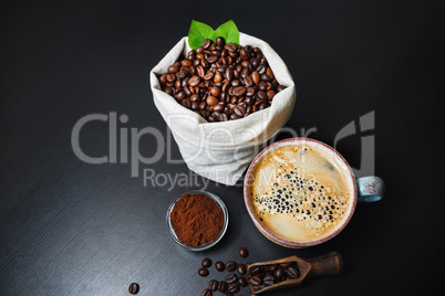 Coffee cup, beans, ground powder