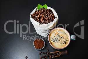 Coffee cup, beans, ground powder