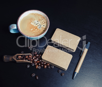 Business cards, coffee cup, pen