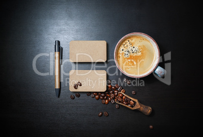 Business cards, coffee, pen