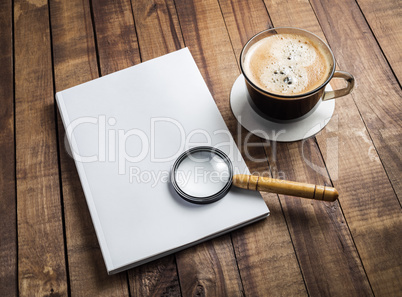 Book, magnifier, coffee cup