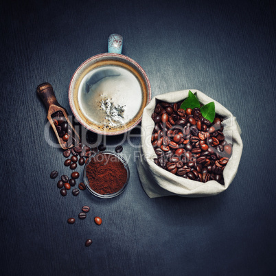 Coffee beans, cup, ground powder