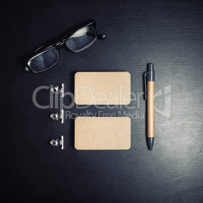 Business cards, glasses, pen