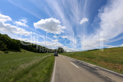 Summer landscape with green fields and beautiful sky