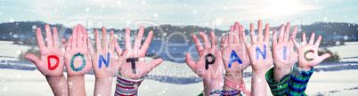 Kids Hands Holding Word Do Not Panic, Snowy Winter Background
