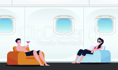 Couple is enjoying drinks sitting in the aircraft