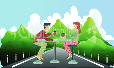 couple is enjoying coffee sitting on the road