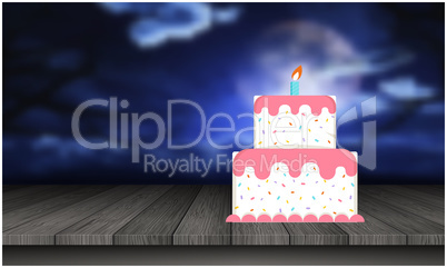 birthday cake is placed on the table at night