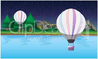 hot air balloons are flying in the sky at night