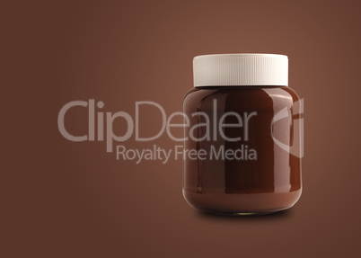 Chocolate spread or nougat cream with hazelnuts in glass jar