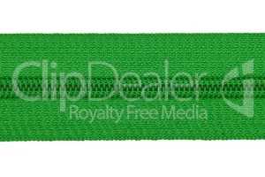Closed green zipper isolated on white background. Green zipper for tailor sewing.