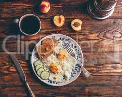 Breakfast toast with fried eggs with vegetables, coffee and frui