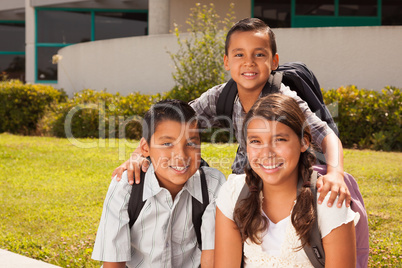 Young Hispanic Student Children Wearing Backpacks On School Camp