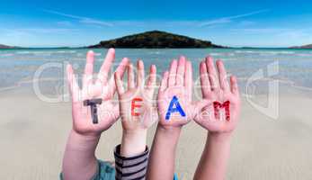 Children Hands Building Word Team, Ocean Background