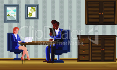 couple sitting in living room and using electronic devices