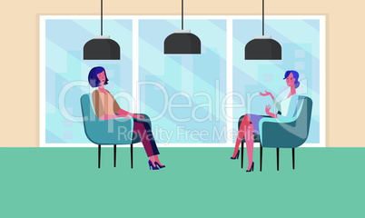 two females are sitting in office for business meeting
