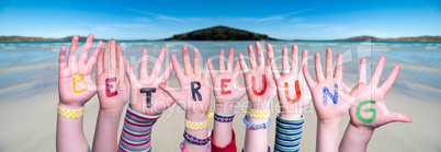 Kids Hands Holding Word Betreuung Means Day Care, Ocean Background