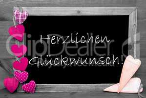 Balckboard With Pink Heart Decoration, Text Glueckwunsch Means Congratulations