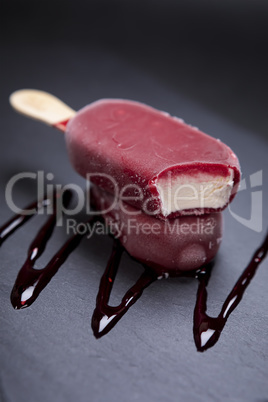 Fruit ice cream stick looks fresh to eat placed on black