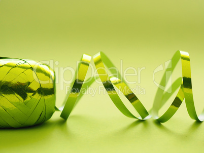 Shiny green ribbon on a green background