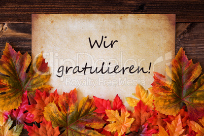 Old Paper With Text Wir Gratulieren Means Congratulations, Colorful Leaves Decoration